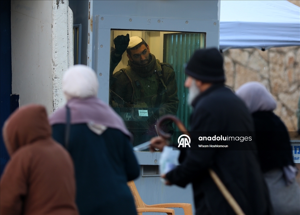 Palestinians cross from Bethlehem to Jerusalem for the second Friday prayer of Ramadan