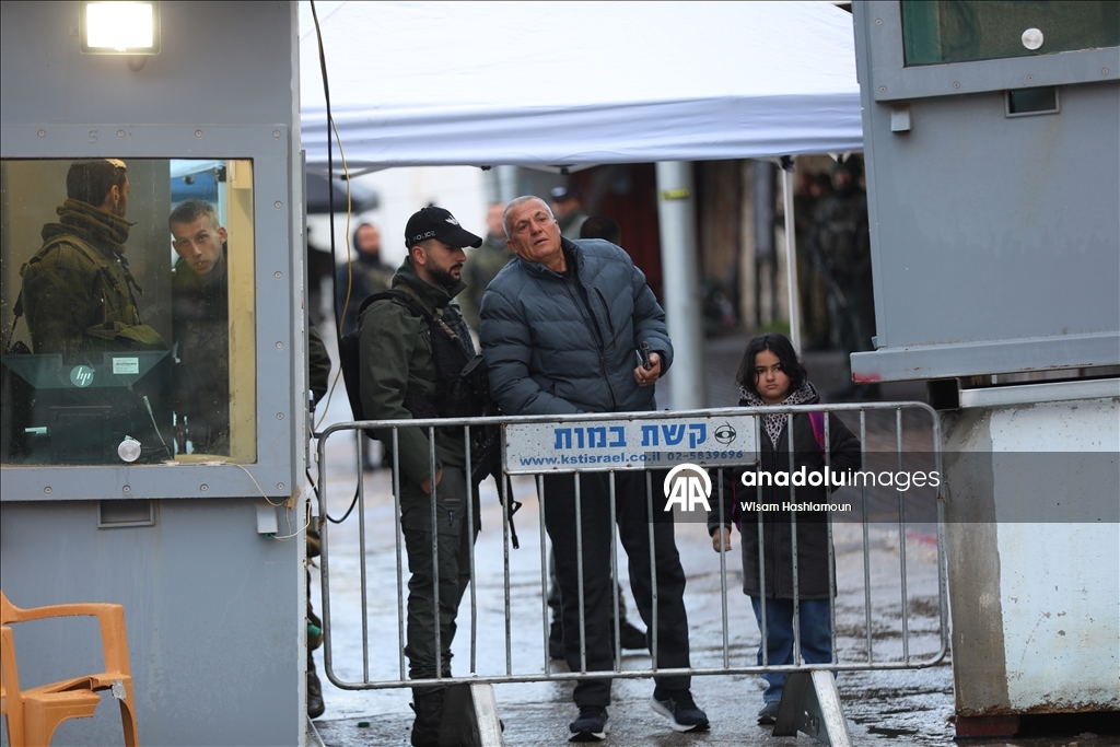 Palestinians cross from Bethlehem to Jerusalem for the second Friday prayer of Ramadan