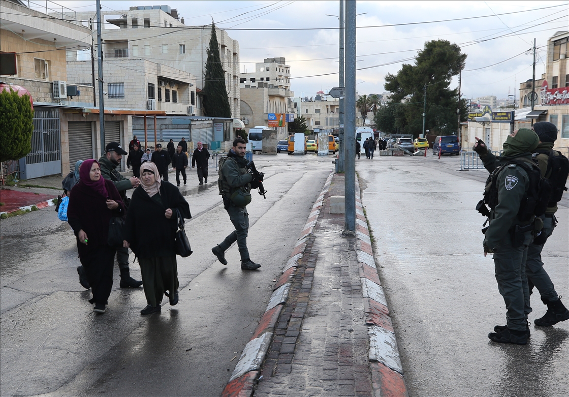 Palestinians cross from Bethlehem to Jerusalem for the second Friday prayer of Ramadan