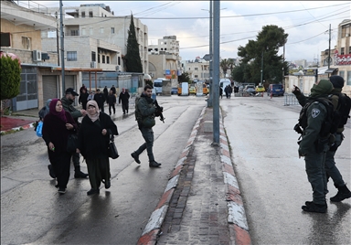 Palestinians cross from Bethlehem to Jerusalem for the second Friday prayer of Ramadan