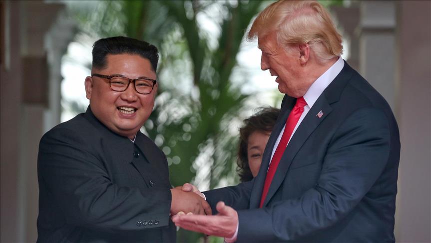 Trump and Kim open historic summit with handshake