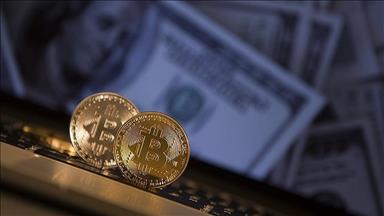 Bitcoin falls below $5,000 for first time in over year