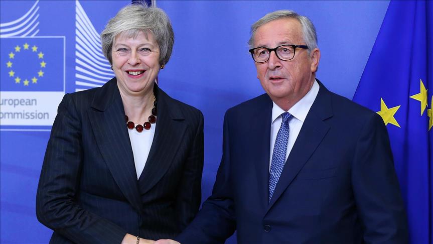 May cites progress on Brexit after meeting with Juncker