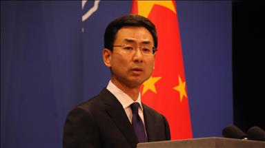 China says will never surrender to foreign pressure