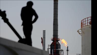 Oil down over supply concerns, strong dollar