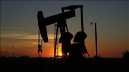 Oil down with Fed inflation forecast, easing geopolitical tensions