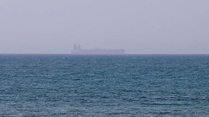 Cargo vessel struck by projectile in Strait of Hormuz, two casualties reported